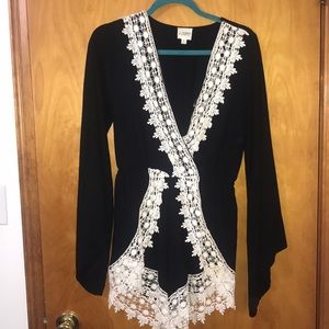 Black romper with white lace trim